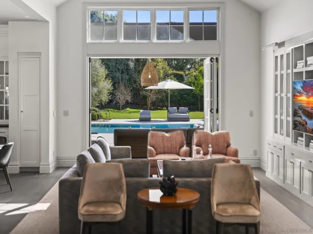 a kitchen with stainless steel appliances granite countertop a stove a sink and a large window