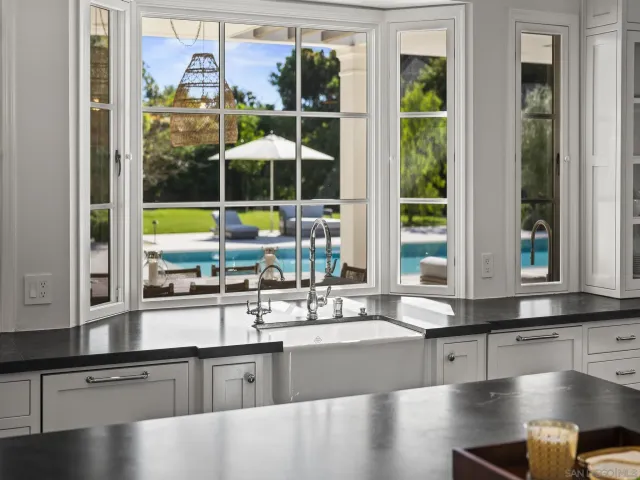 a kitchen with sink and cabinets