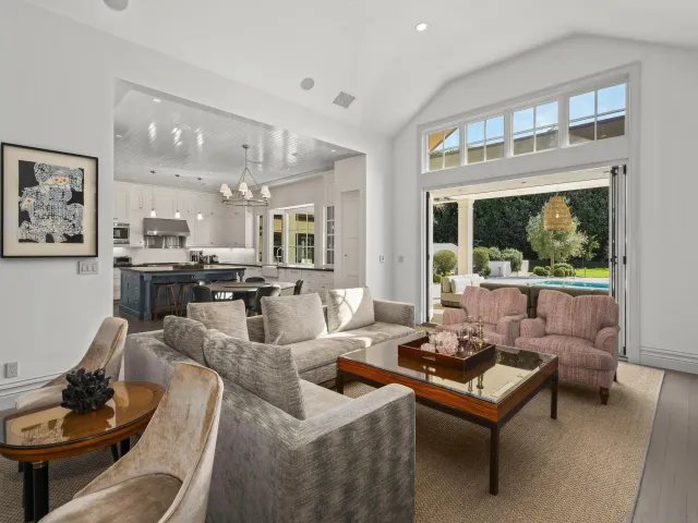 a bedroom with a large bed and a large window