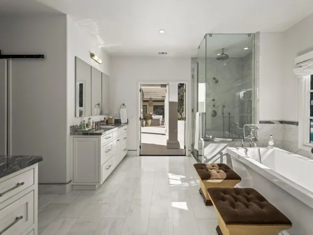 a bathroom with a sink and a large mirror