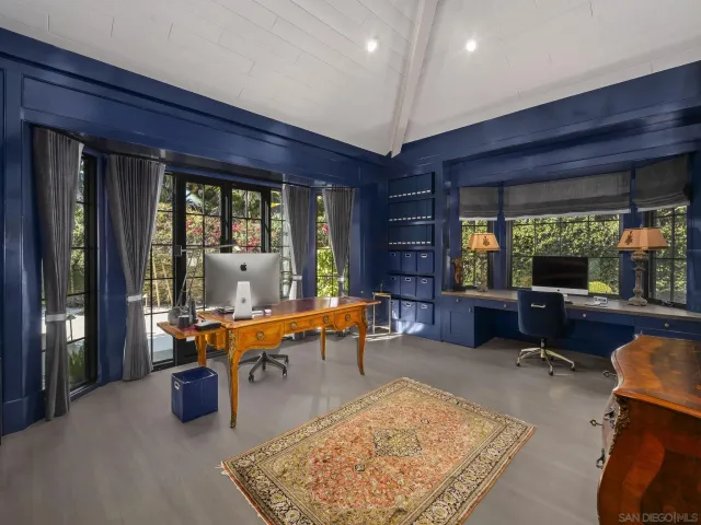 a bedroom with a large bed and a large window