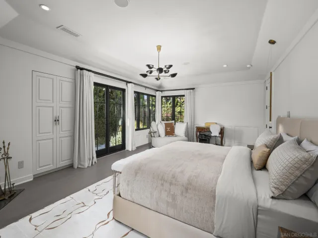 a room with furniture pool table and window