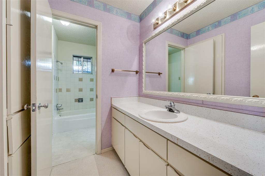 3511 Rio Grande Circle Dallas, TX 75233 - Photo 12 of 15 a bathroom with a sink and a mirror