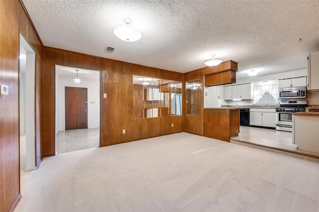 3511 Rio Grande Circle Dallas, TX 75233 - Photo 6 of 15 a view of a kitchen with a sink and a refrigerator