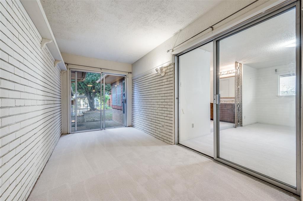 3511 Rio Grande Circle Dallas, TX 75233 - Photo 7 of 15 a view of a hallway with wooden floor and a bathroom