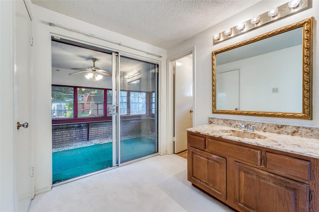3511 Rio Grande Circle Dallas, TX 75233 - Photo 9 of 15 a bathroom with a sink and a mirror