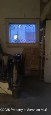 a bathroom with a shower and a glass door