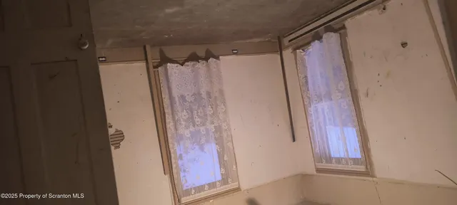 a kitchen with granite countertop cabinets and window