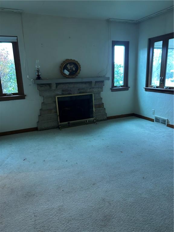 1117 Schweitzer Road McKeesport, PA 15135 - Photo 5 of 8 an empty room with windows and fireplace