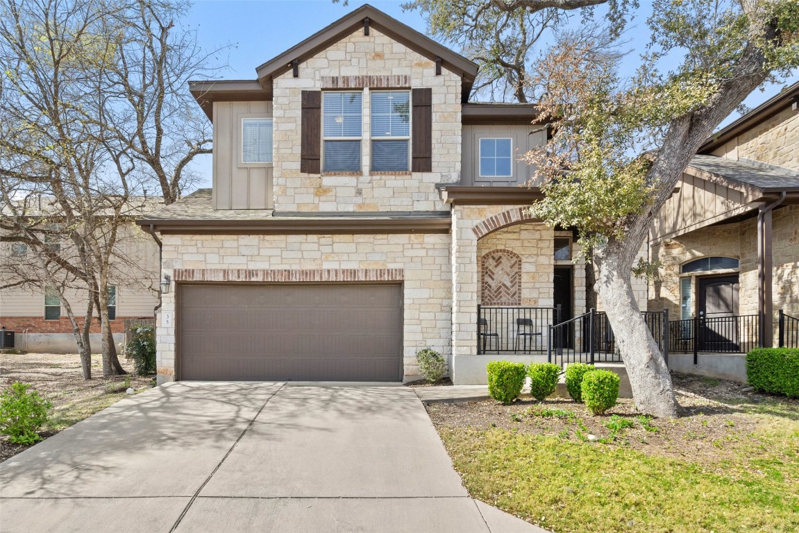 a front view of a house with garden