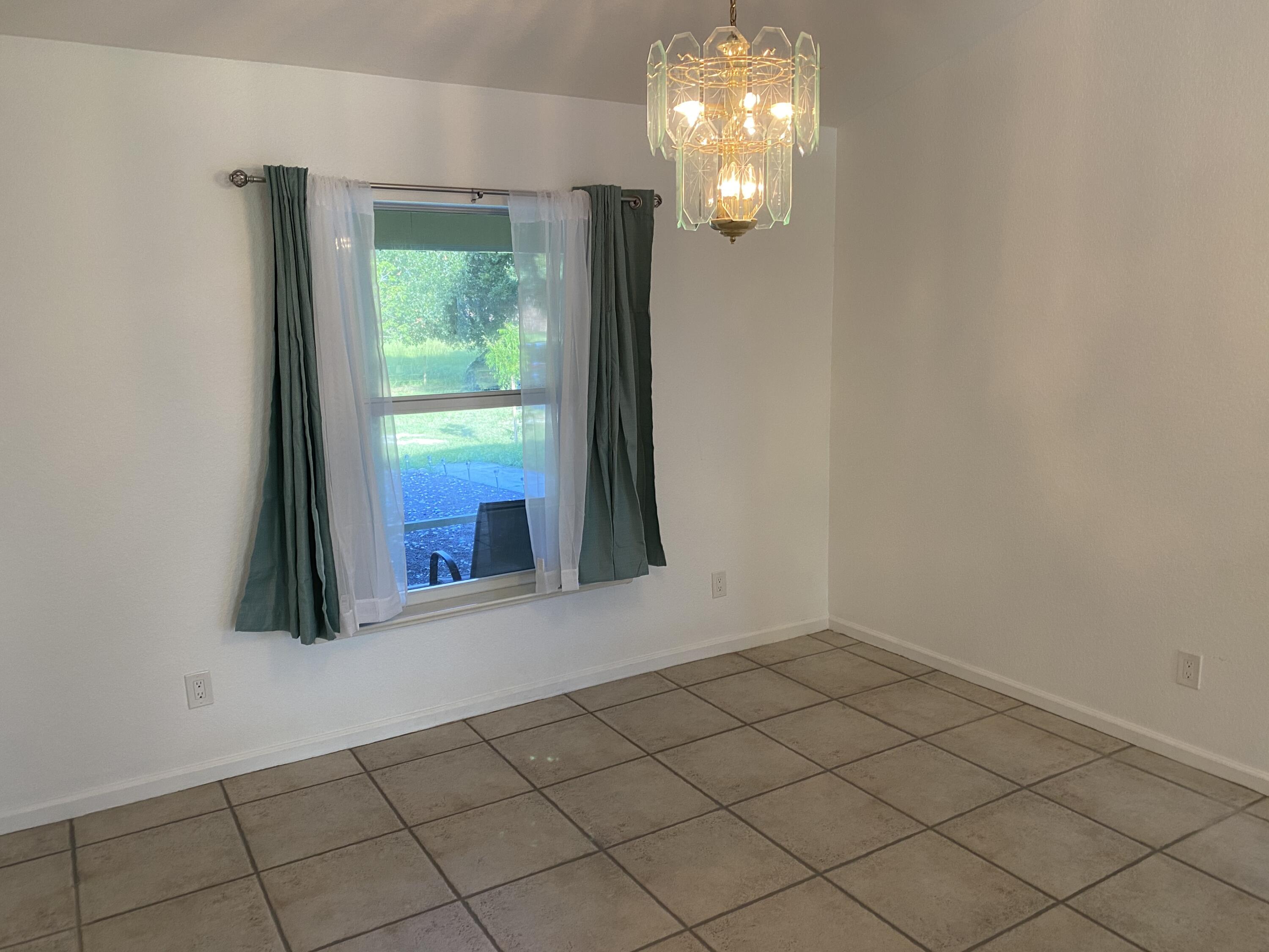 5425 Koblegard Road Fort Pierce, FL 34951 - Photo 16 of 33 an empty room with windows and outdoor view