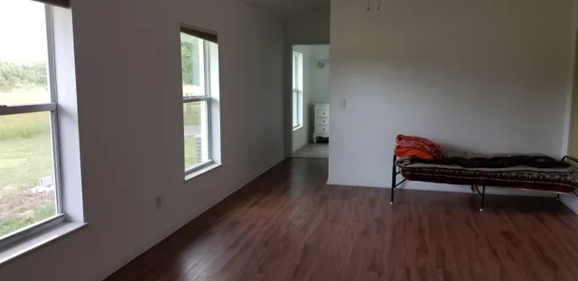 a bathroom with a granite countertop sink a shower and a mirror