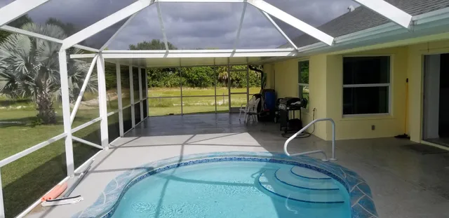 a view of yard with a swimming pool