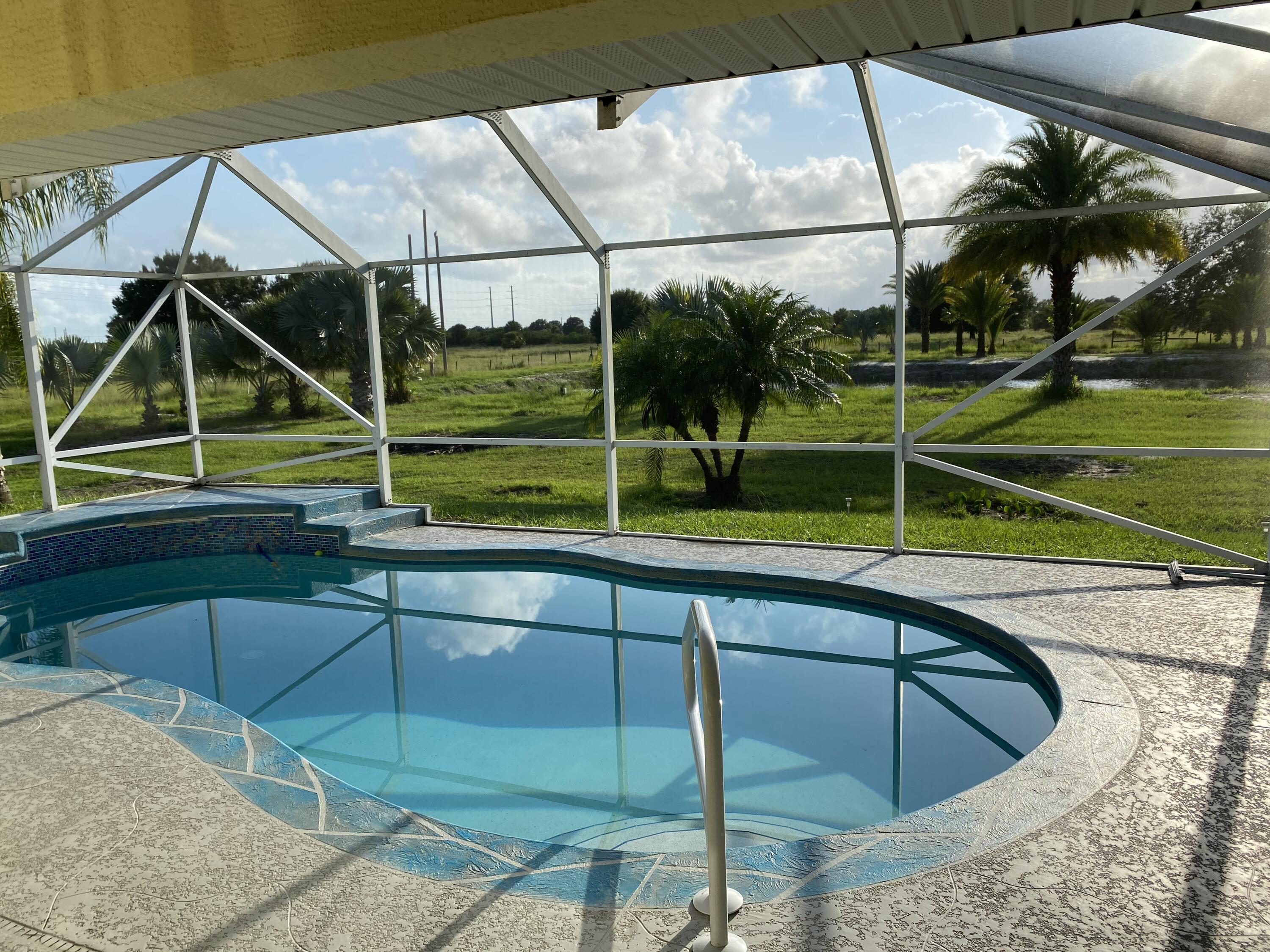 5425 Koblegard Road Fort Pierce, FL 34951 - Photo 28 of 33 a view of yard with a swimming pool