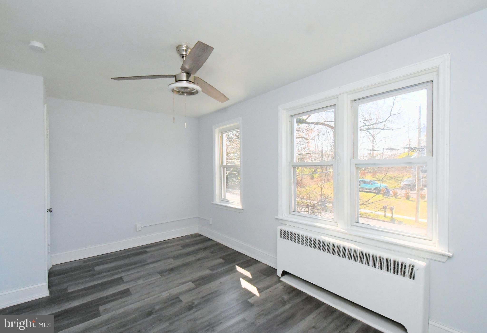 2721 Cowpath Road Hatfield, PA 19440 - Photo 13 of 29 a view of an empty room with wooden floor and a window