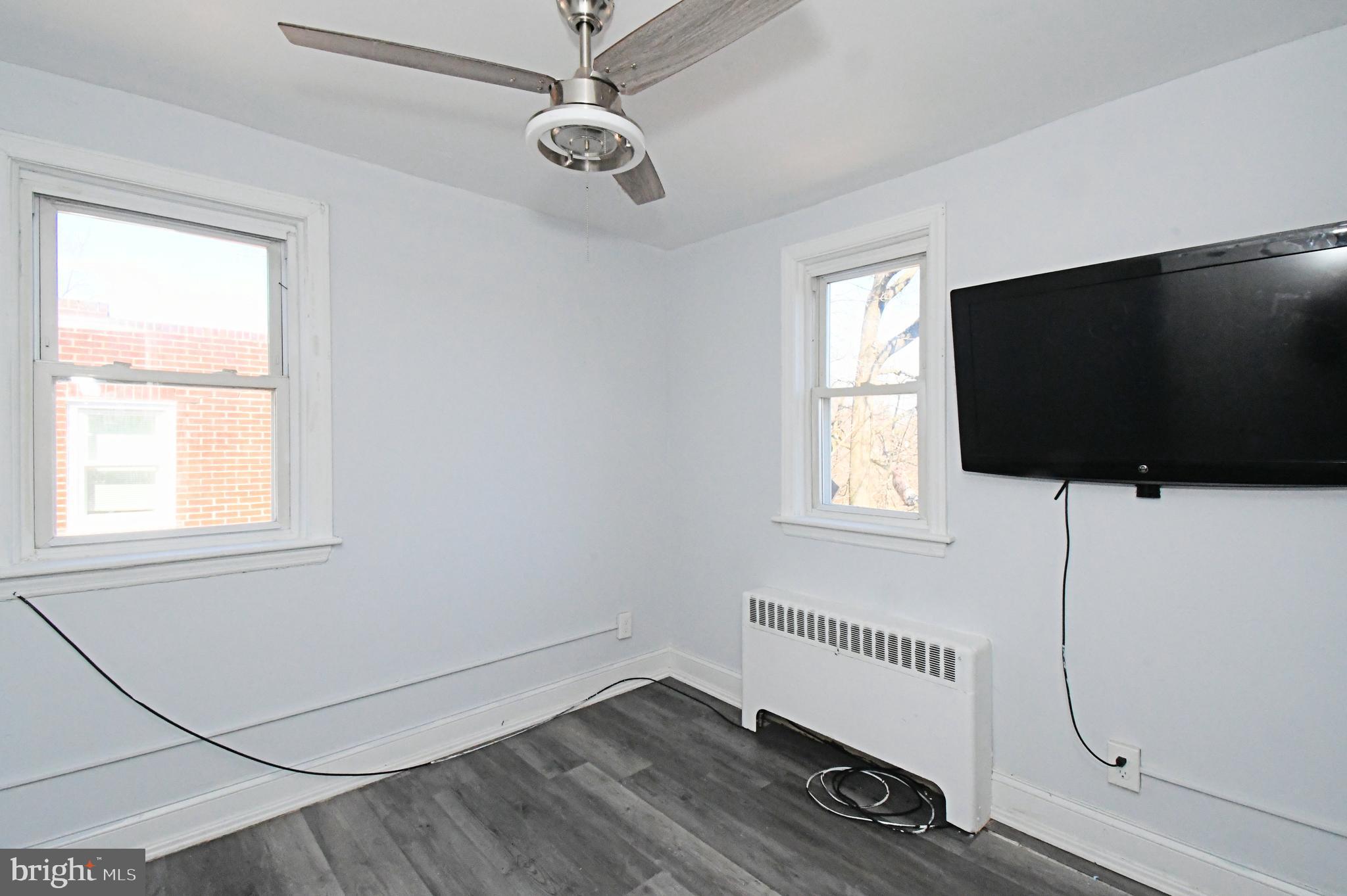 2721 Cowpath Road Hatfield, PA 19440 - Photo 15 of 29 an empty room with wooden floor fan and windows