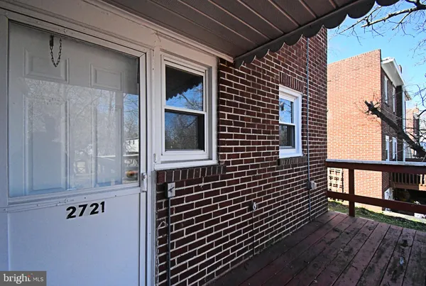 a view of a brick house with wooden floor