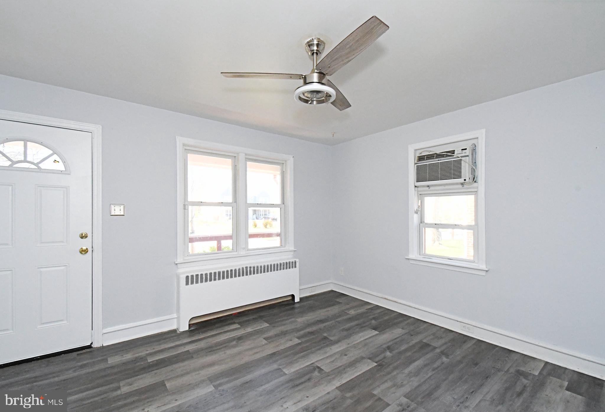 2721 Cowpath Road Hatfield, PA 19440 - Photo 5 of 29 an empty room with wooden floor a ceiling fan and windows