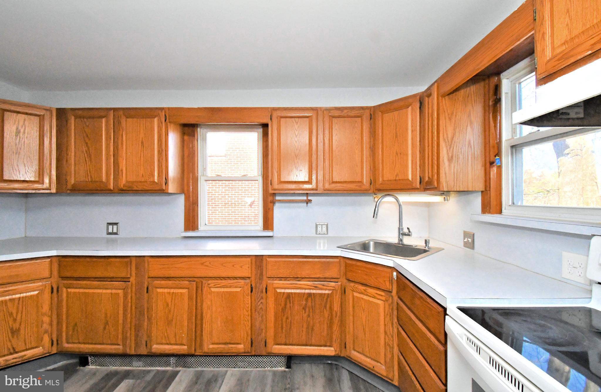2721 Cowpath Road Hatfield, PA 19440 - Photo 10 of 29 a kitchen with wooden cabinets and a sink