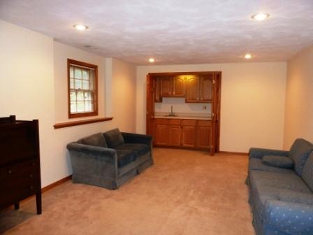 2618 Miller Road Geneva, IL 60134 - Photo 13 of 16 a living room with furniture and a flat screen tv