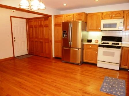 2618 Miller Road Geneva, IL 60134 - Photo 3 of 16 a kitchen with stainless steel appliances granite countertop a refrigerator a stove and a sink