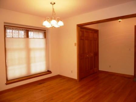 2618 Miller Road Geneva, IL 60134 - Photo 5 of 16 a view of a big room with wooden floor and chandelier