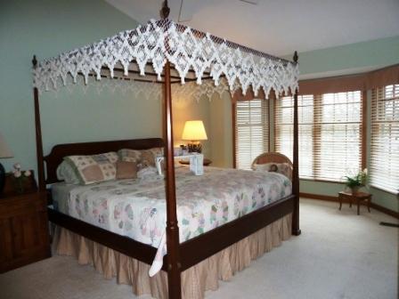 2618 Miller Road Geneva, IL 60134 - Photo 8 of 16 a bed sitting in a bedroom next to a window