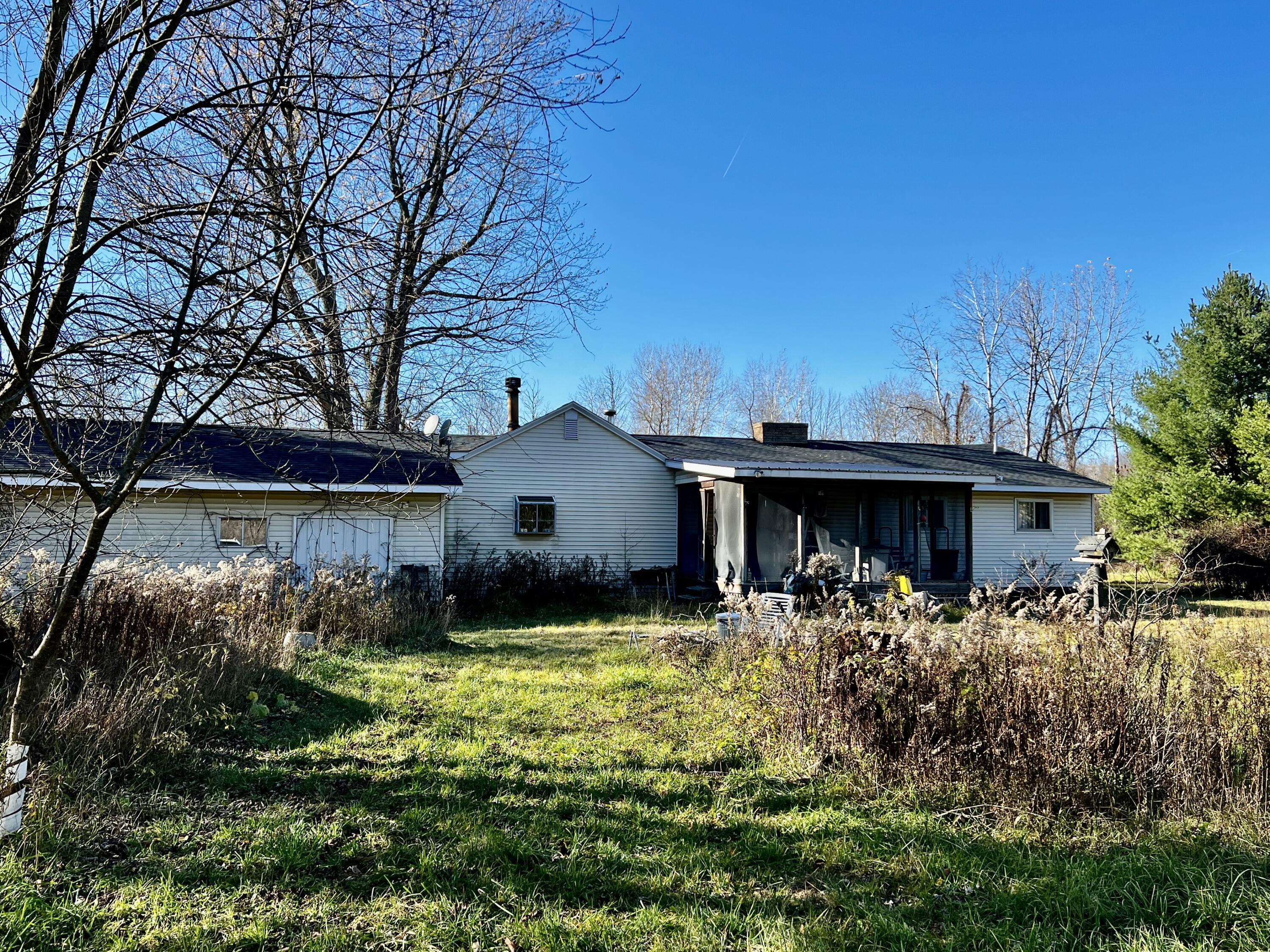 2720 South Sullivan Road Ravenna, MI 49451 - Photo 11 of 21 back of house w/screened-in porch