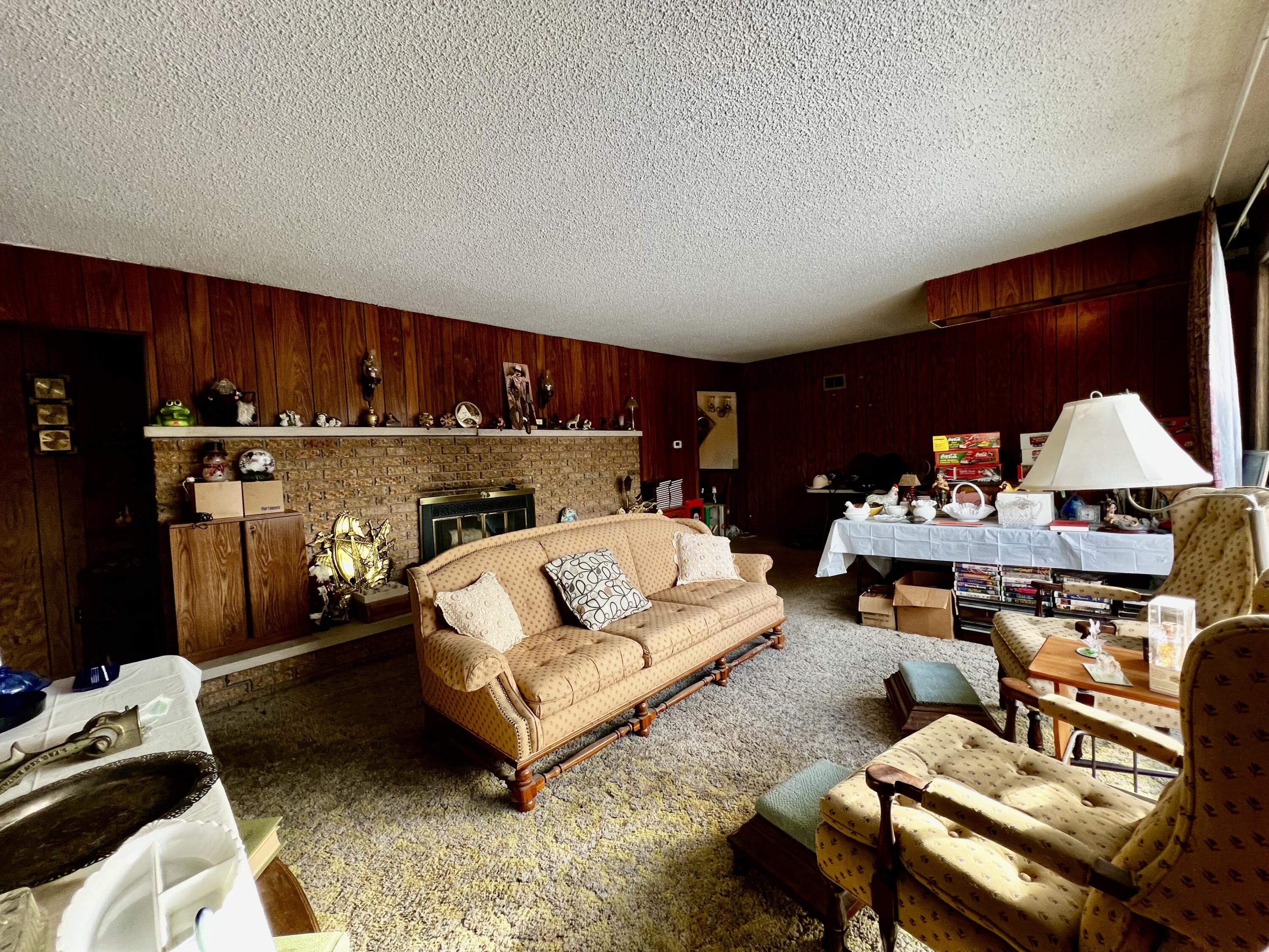 2720 South Sullivan Road Ravenna, MI 49451 - Photo 17 of 21 Living room with wood burning fireplace