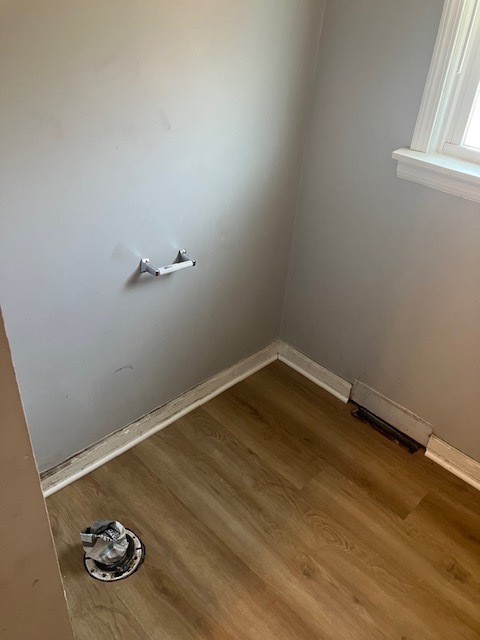 17821 Roy Street Lansing, IL 60438 - Photo 13 of 17 a room with a wooden floor and shoes