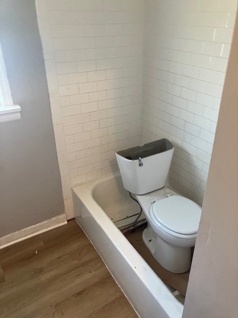 17821 Roy Street Lansing, IL 60438 - Photo 14 of 17 a white toilet sitting next to a white wall