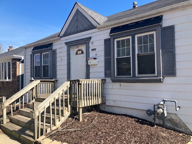 17821 Roy Street Lansing, IL 60438 - Photo 2 of 17 a front view of a house with balcony