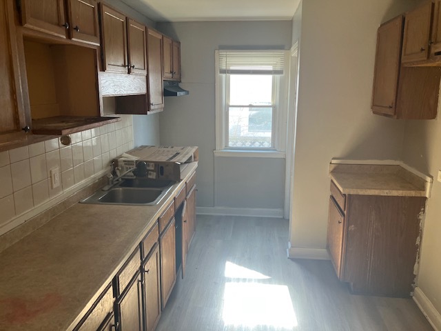 17821 Roy Street Lansing, IL 60438 - Photo 3 of 17 a kitchen with a sink stove and microwave