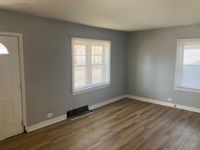 17821 Roy Street Lansing, IL 60438 - Photo 5 of 17 an empty room with wooden floor and windows