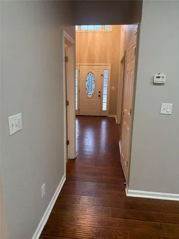 a view of gallery with wooden floor