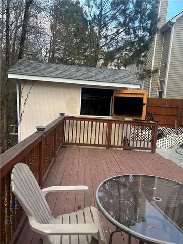 a view of backyard with seating space and trees