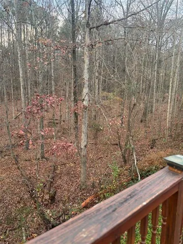 a view of a wooden fence with a bench