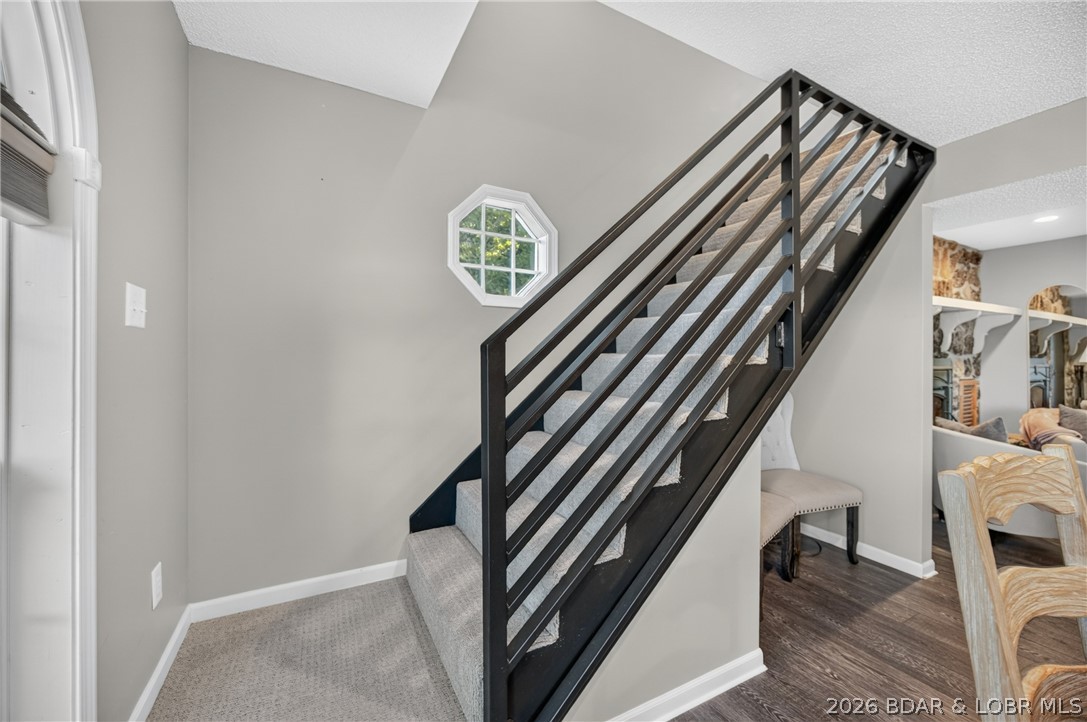26427 Lake Front Road Rocky Mount, MO 65072 - Photo 25 of 69 Flowing open concept staircase