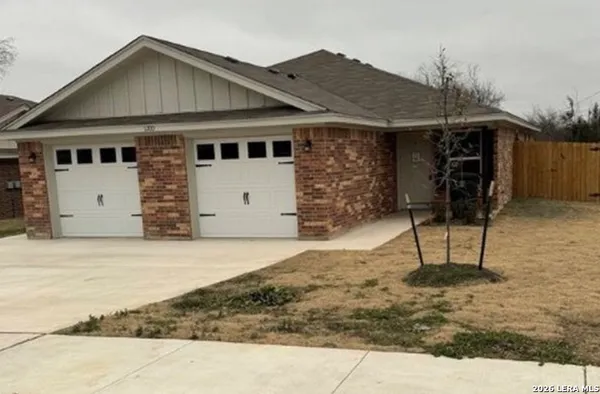 a front view of house with a yard
