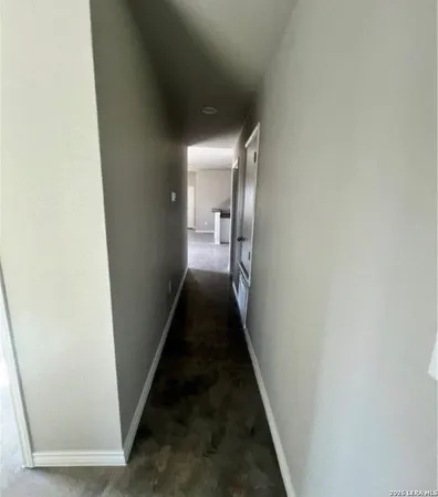 a view of a hallway with a glass door