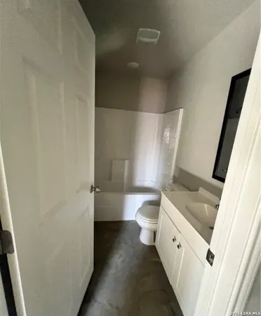 a bathroom with a sink and toilet