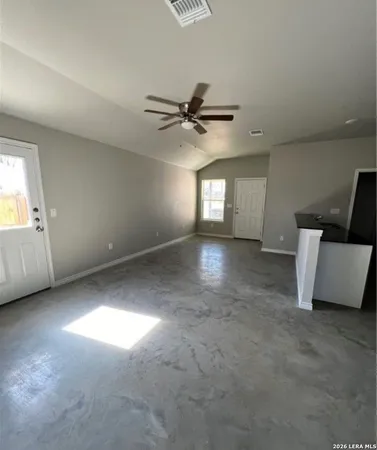 a view of an empty room with a window
