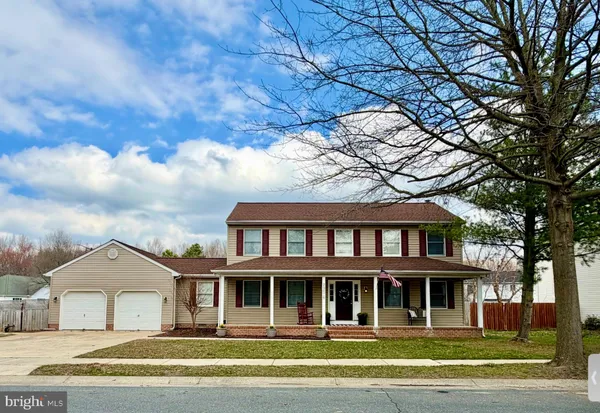 a front view of residential houses with yard
