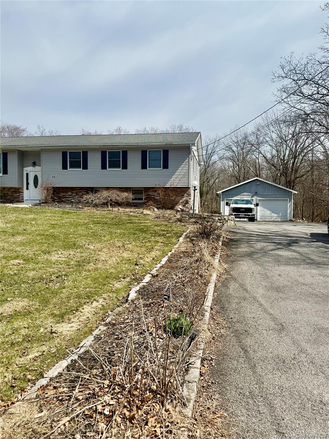 14 Alary Road, Unit 2 LaGrangeville, NY 12540 - Photo 1 of 1 a front view of a house with a yard