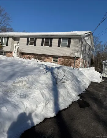 a view of a backyard with large trees
