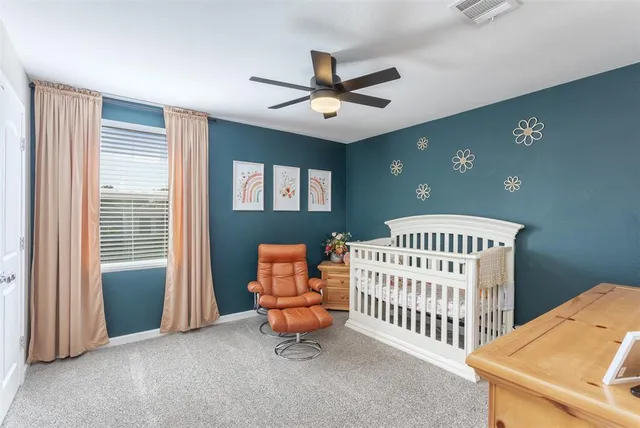 a bedroom with furniture and a window