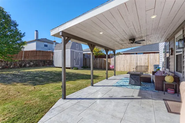 a view of a house with backyard and porch