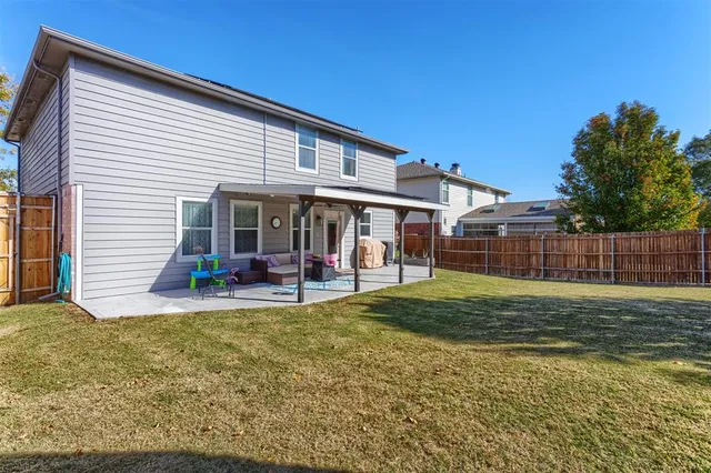 a view of a house with a yard porch and sitting area