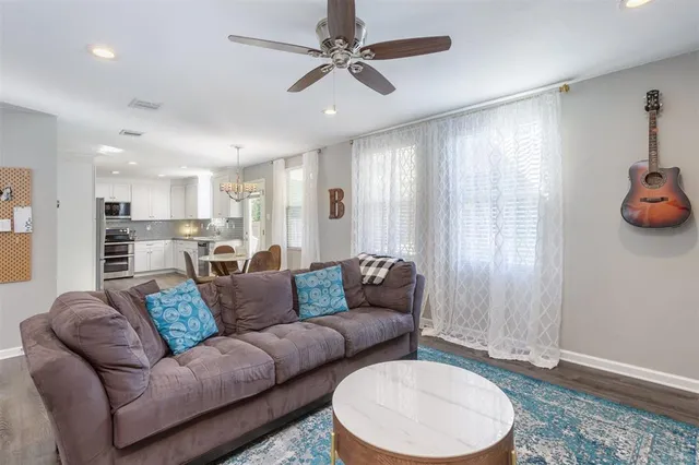 a living room with furniture and a table