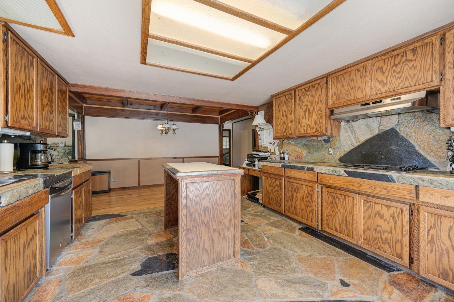 15310 Tyler Foote Road Nevada City, CA 95959 - Photo 17 of 63 a kitchen with sink cabinets and stove top oven